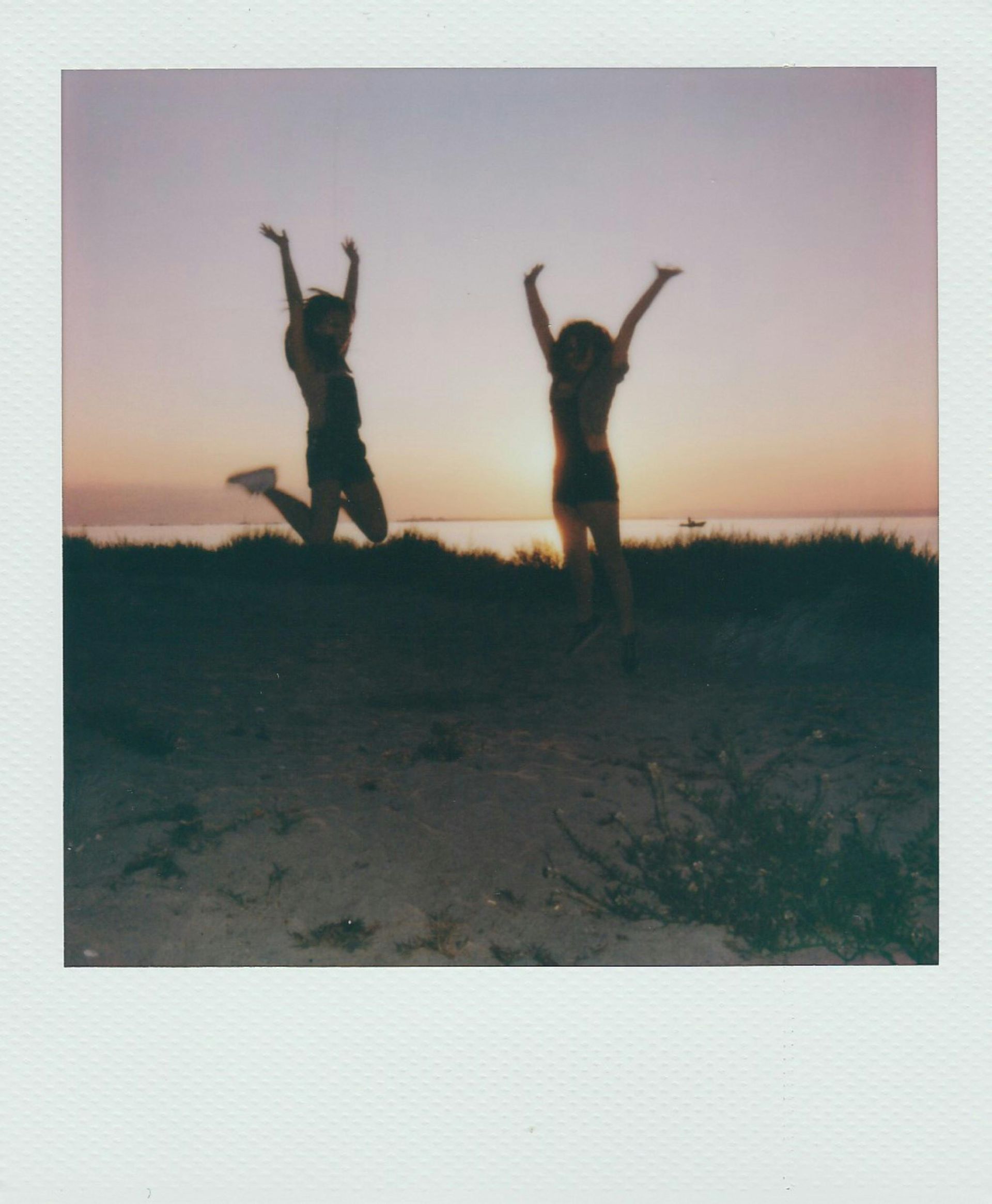two people celebrating together at sunset symbolizing deep soul connection and spiritual familiarity