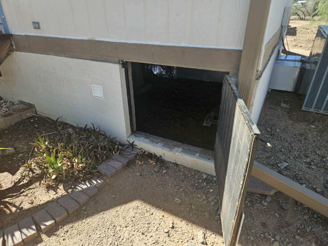 Crawlspace access opening on a block foundation