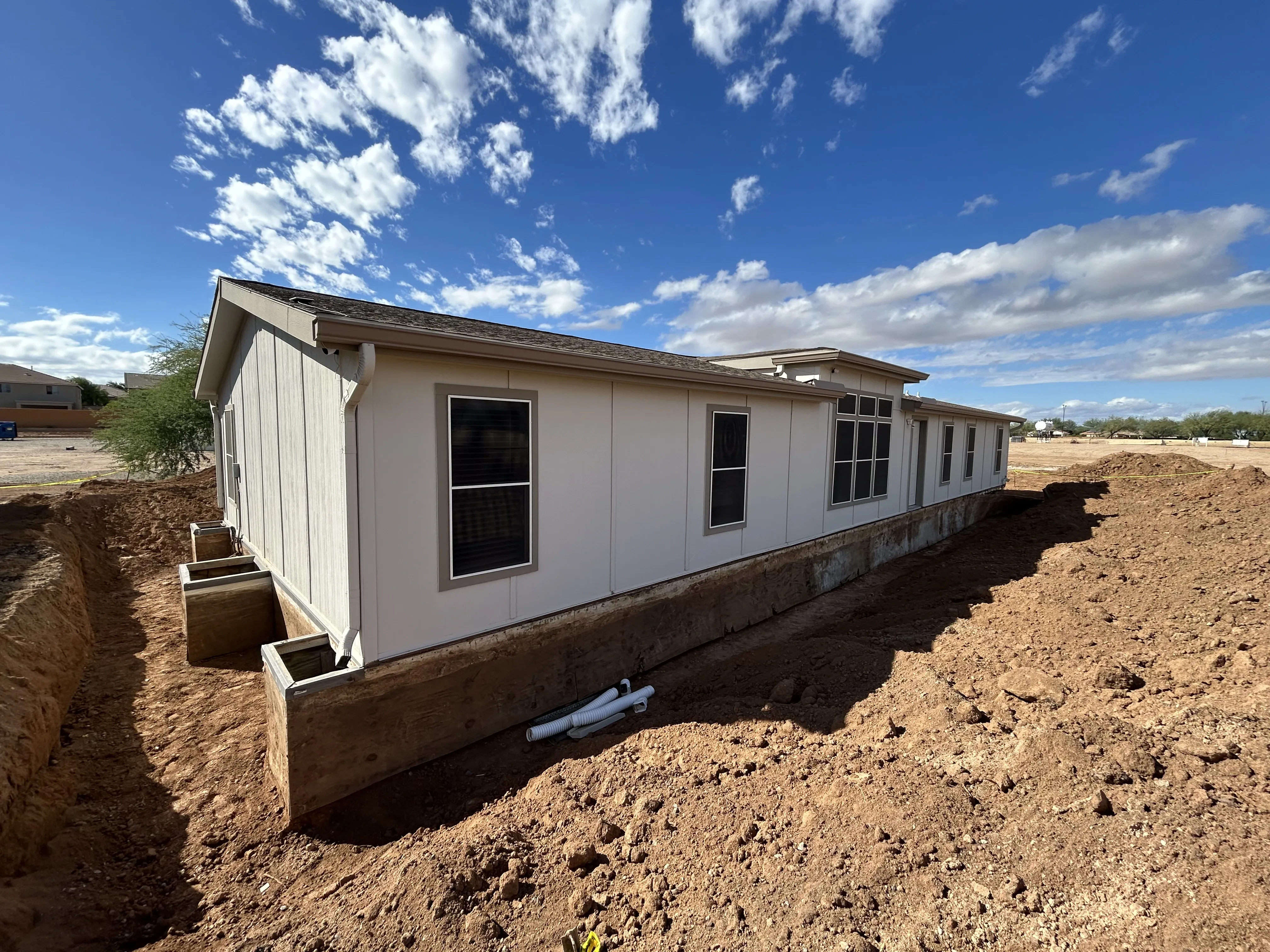 Arizona manufactured home set on a new foundation under a blue sky