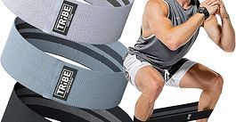 Gray TRIBE resistance bands beside a person doing a squat exercise on a bench