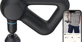 Black massage gun attached to a phone mount, shown beside a smartphone display.