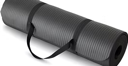 Black rolled yoga mat with carrying strap on a white background