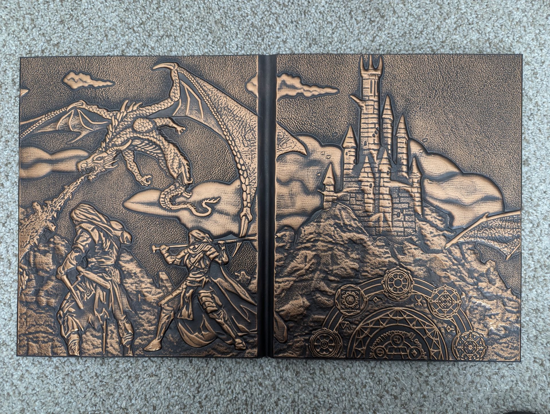 A painting of a dragon and a castle on a table.