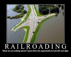 Aerial view of a flooded road intersection, with the text 