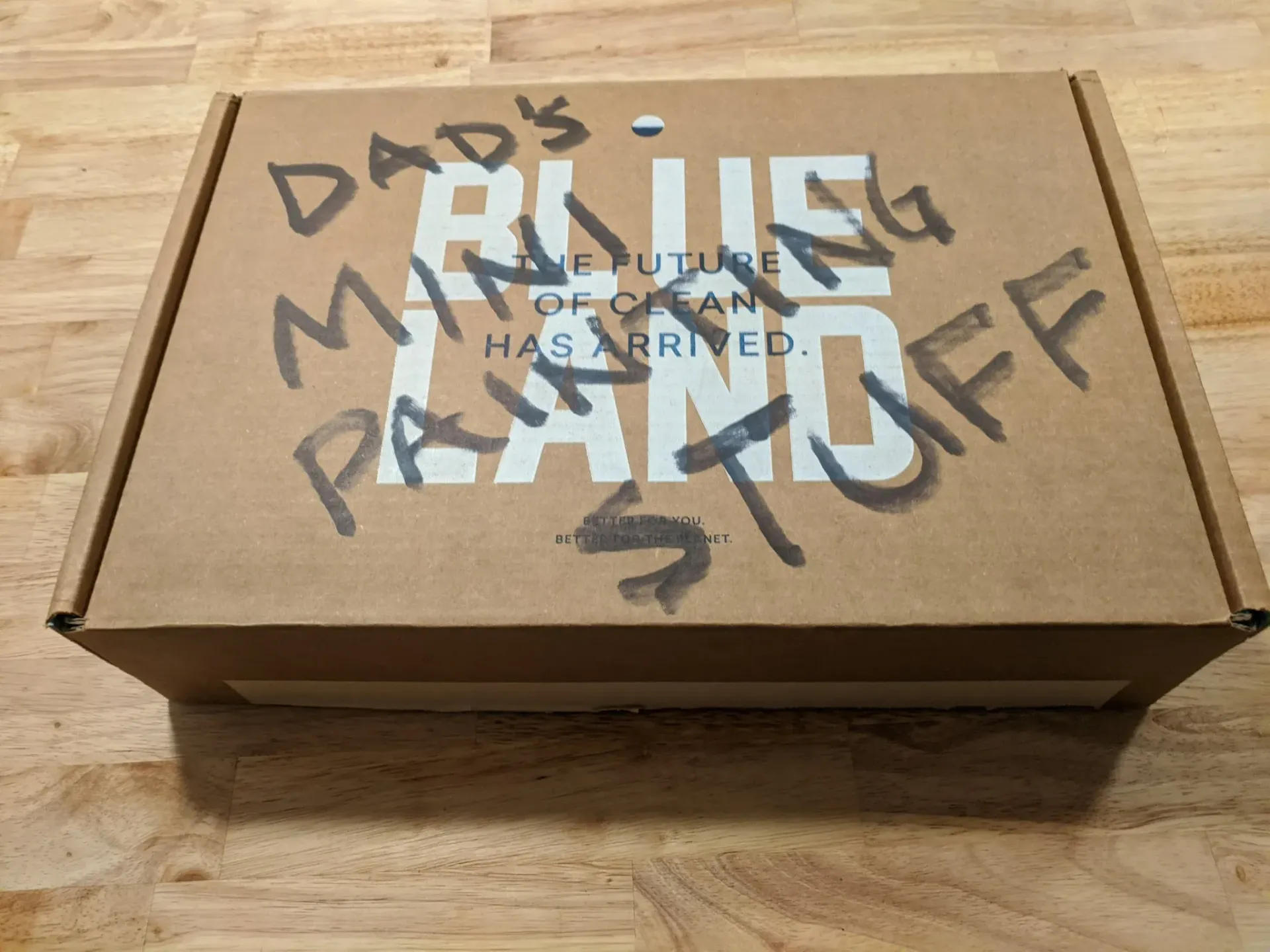 Cardboard box with handwritten text 