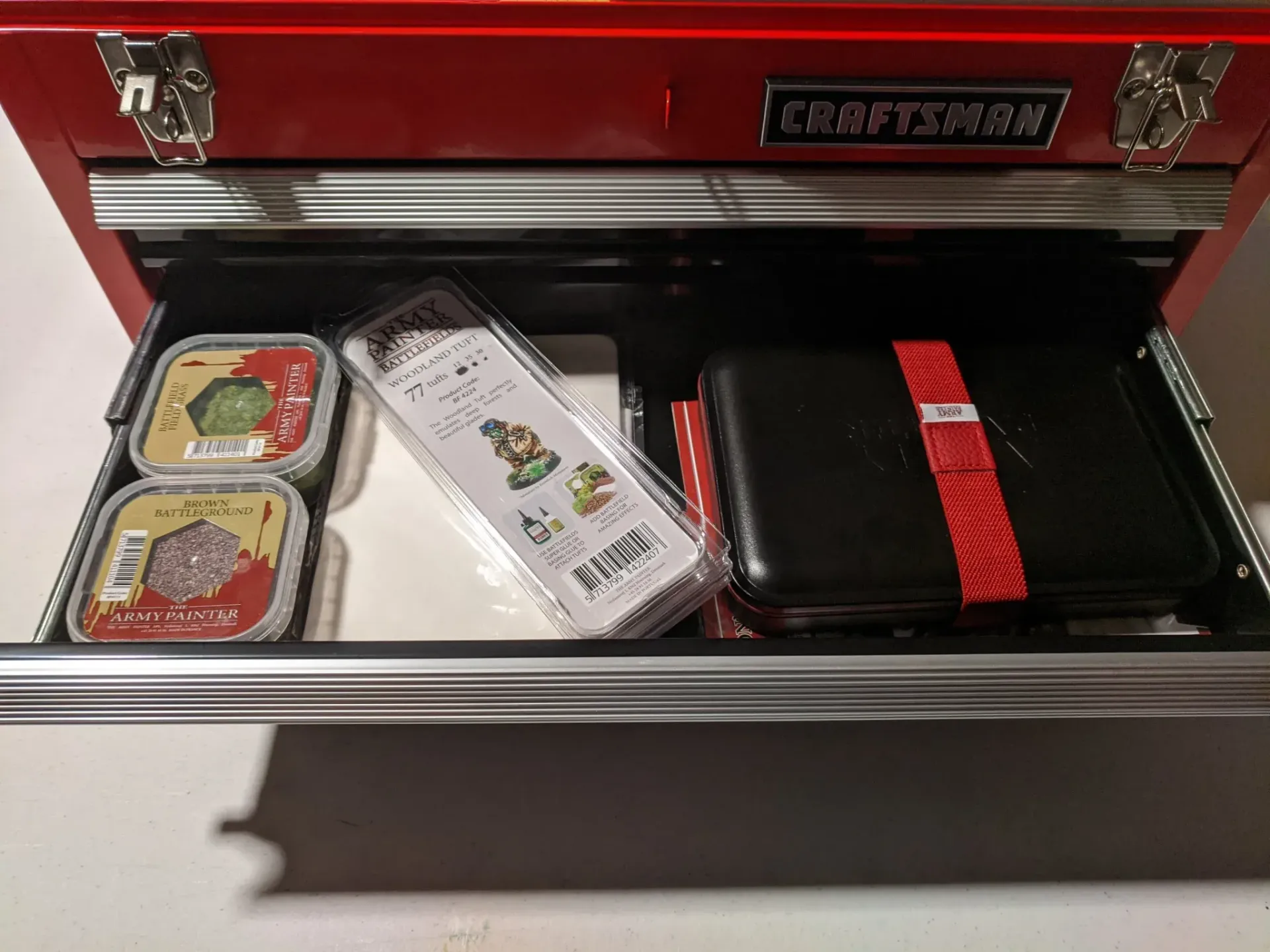 A red Craftsman toolbox drawer is open, holding food items.