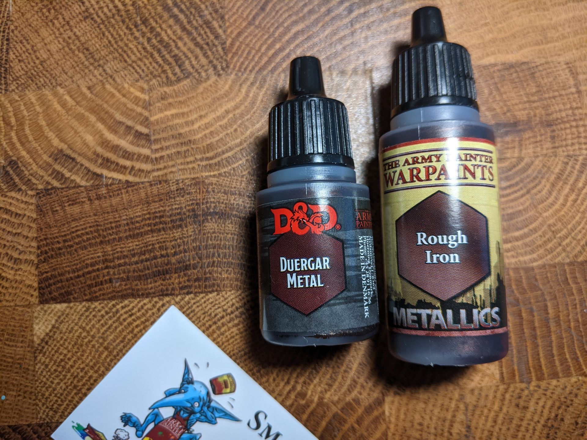 Two bottles of metallic hobby paint,