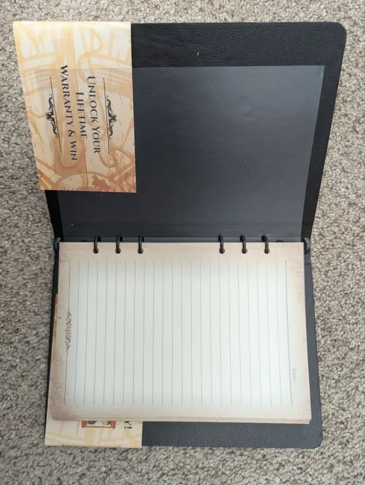 A notebook with a piece of paper that says ' chuck 's mail ' on it