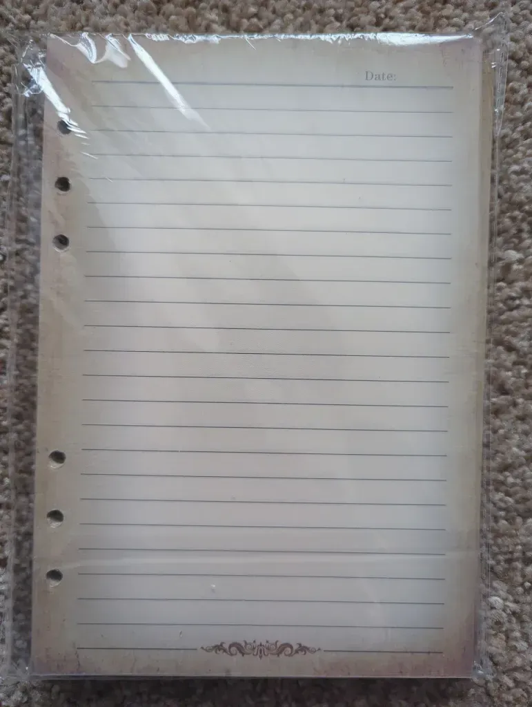 A piece of lined paper is in a plastic bag.