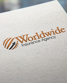 A close up of a worldwide insurance agency logo on a piece of paper.