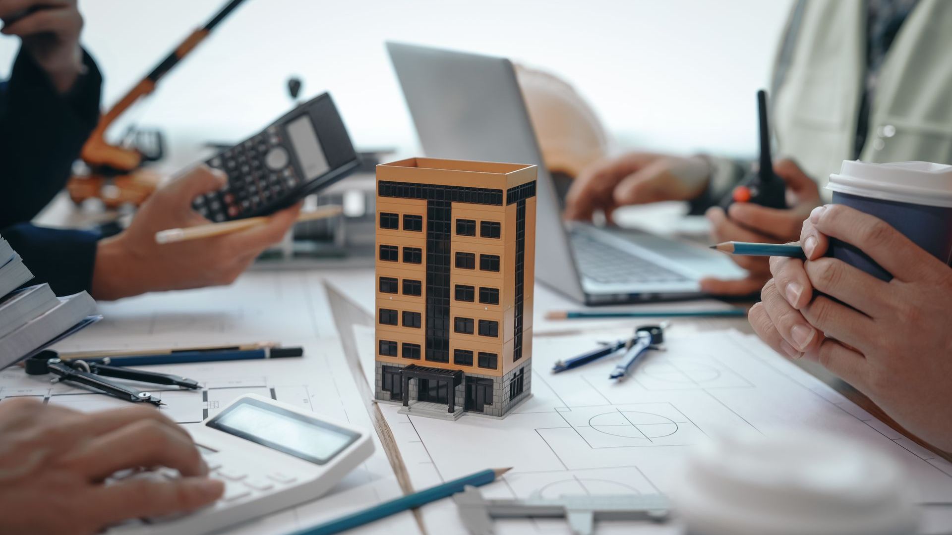 A Man Is Plastering A Wall With A Trowel