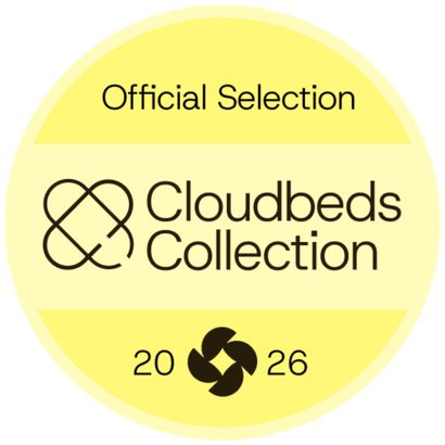 Yellow festival-style badge reading “Official Selection Cloudbeds Collection 2026” with abstract logo.