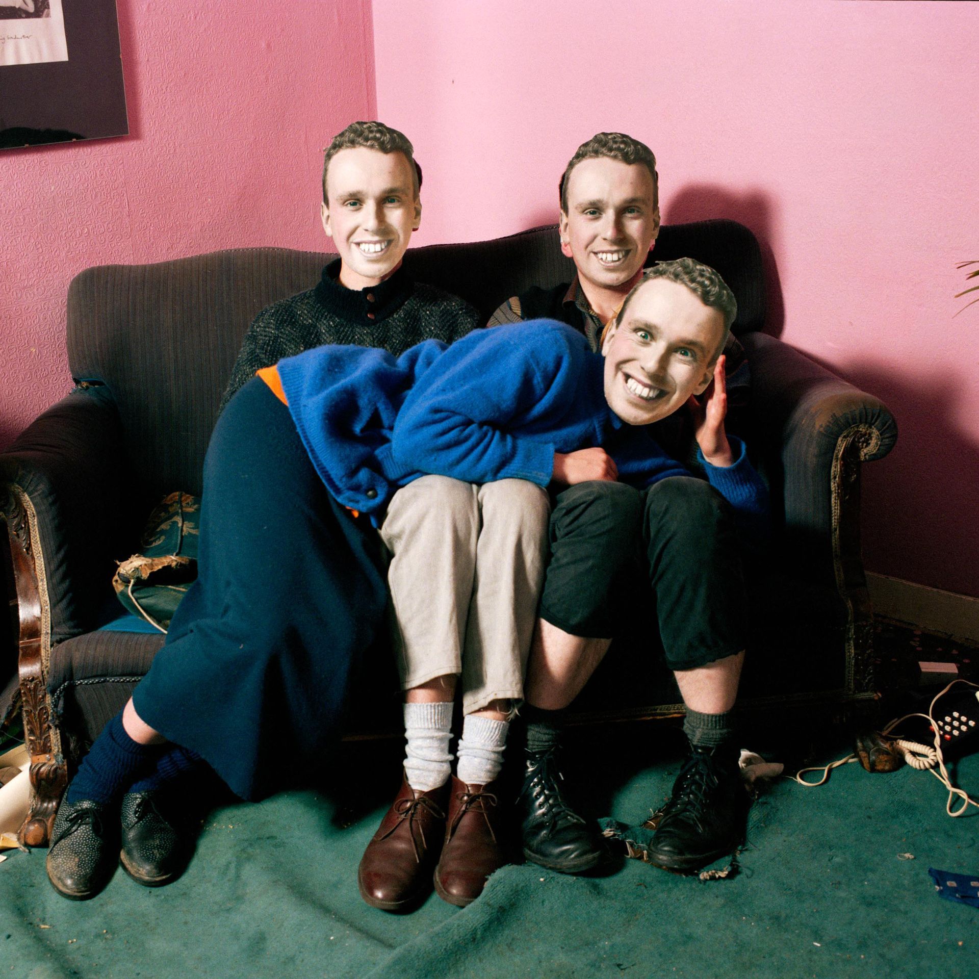 This series was made in 1986 while I was studying at the Royal College of Art in London. This work has been exhibited widely and is part of the Photography Collection of the Victoria and Albert Museum, London.
To make these images, I photographed myself 20 times to make the expressions I needed. These photographs were then trimmed to make flat masks. The performers then wore the masks in situ. 
These are single exposure, pre-Photoshop images. The masks look 3D but are, in fact, flat. For more information on the masks, see here. 
William Hogarth first told this tale about Tom Rakewell, in 1733, in a set of engravings. In Hogarth’s story, the Rake is a morally bankrupt individual who squanders his father’s inheritance on women, gambling, and drinking. He marries badly and ends up mad and destitute in Bedlam.
My Rake enters life with every intention of doing 