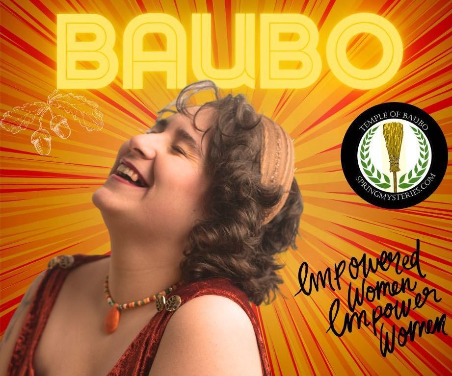 A woman is smiling in front of a banner that says baubo