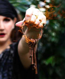 A woman is holding a bunch of keys in her hand.