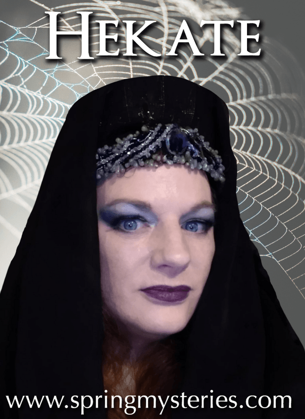 Isidora LaVeau, dressed in a dark headdress, representing Hekate.