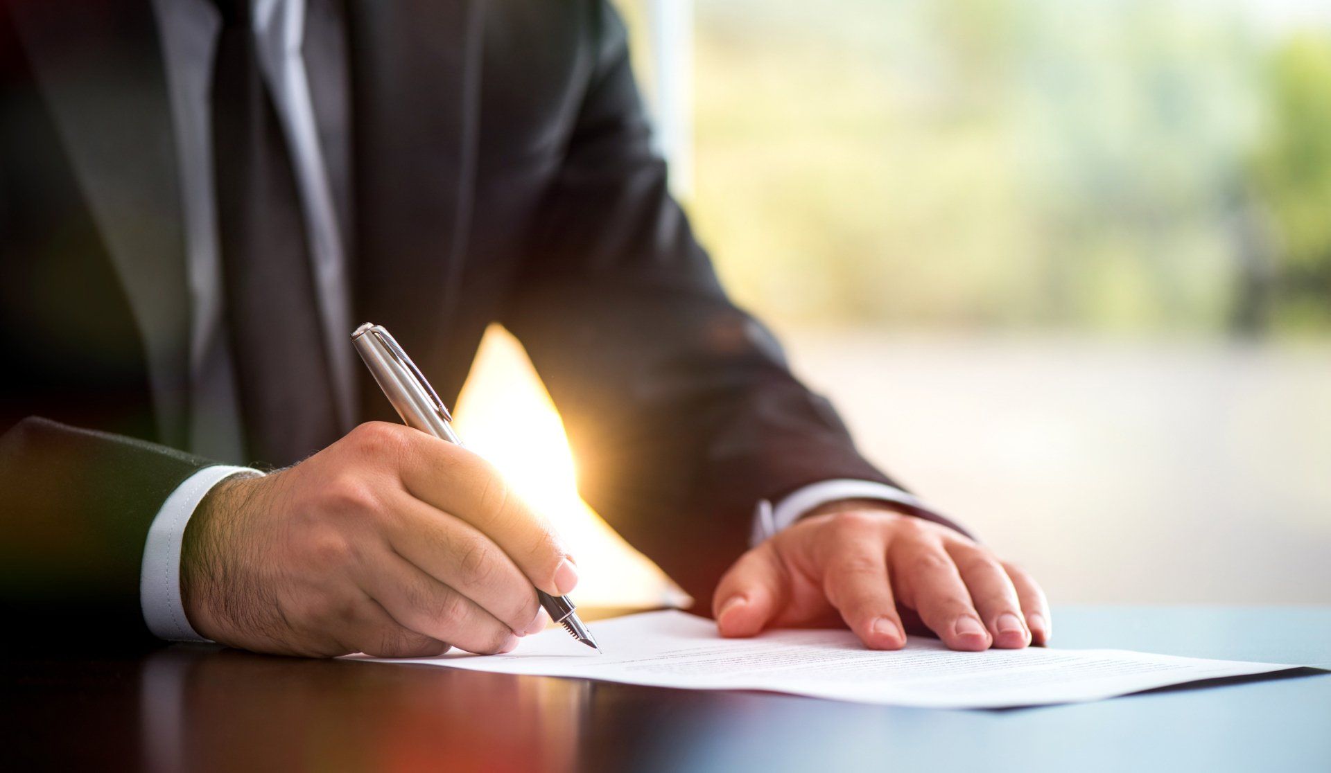 Signing a legal document - Kokomo, IN - Kuntz Law Firm