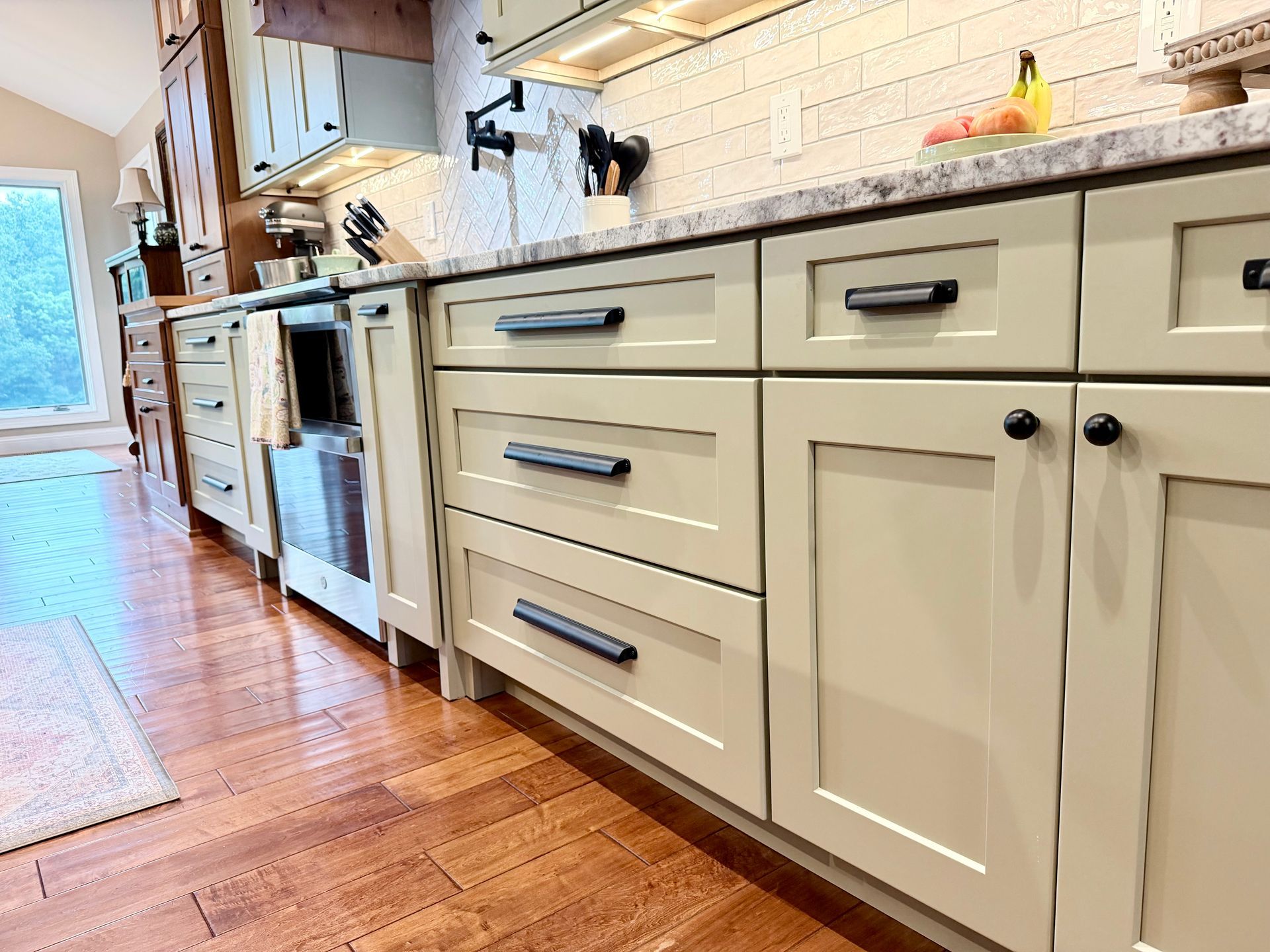 Completed custom kitchen remodel in Northern Kentucky with warm cabinetry and stone countertops