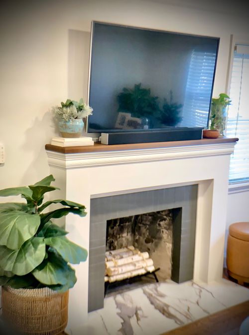 Custom fireplace surround with cabinetry integration in a Northern Kentucky living room