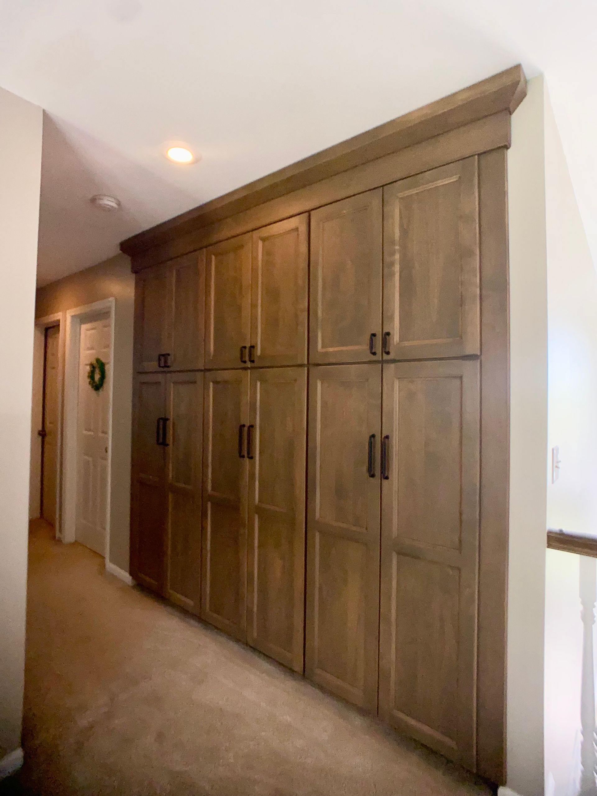 Cabinet design consultant reviewing materials and door samples at Wood and Stone studio