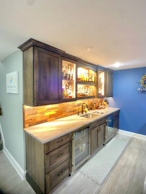 Custom home bar with cabinetry and countertops built by Wood and Stone in Northern Kentucky