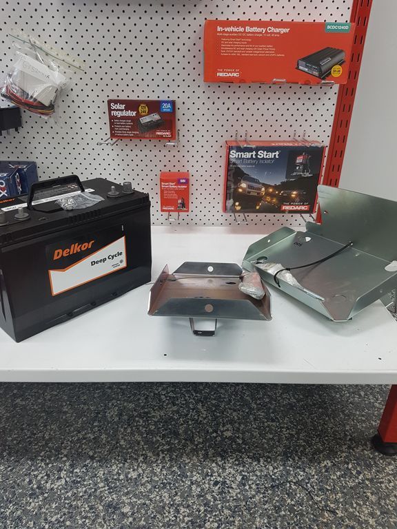 A Driller Battery Is Sitting On A White Table — Autofit88 Auto Electrics In Ciccone, NT
