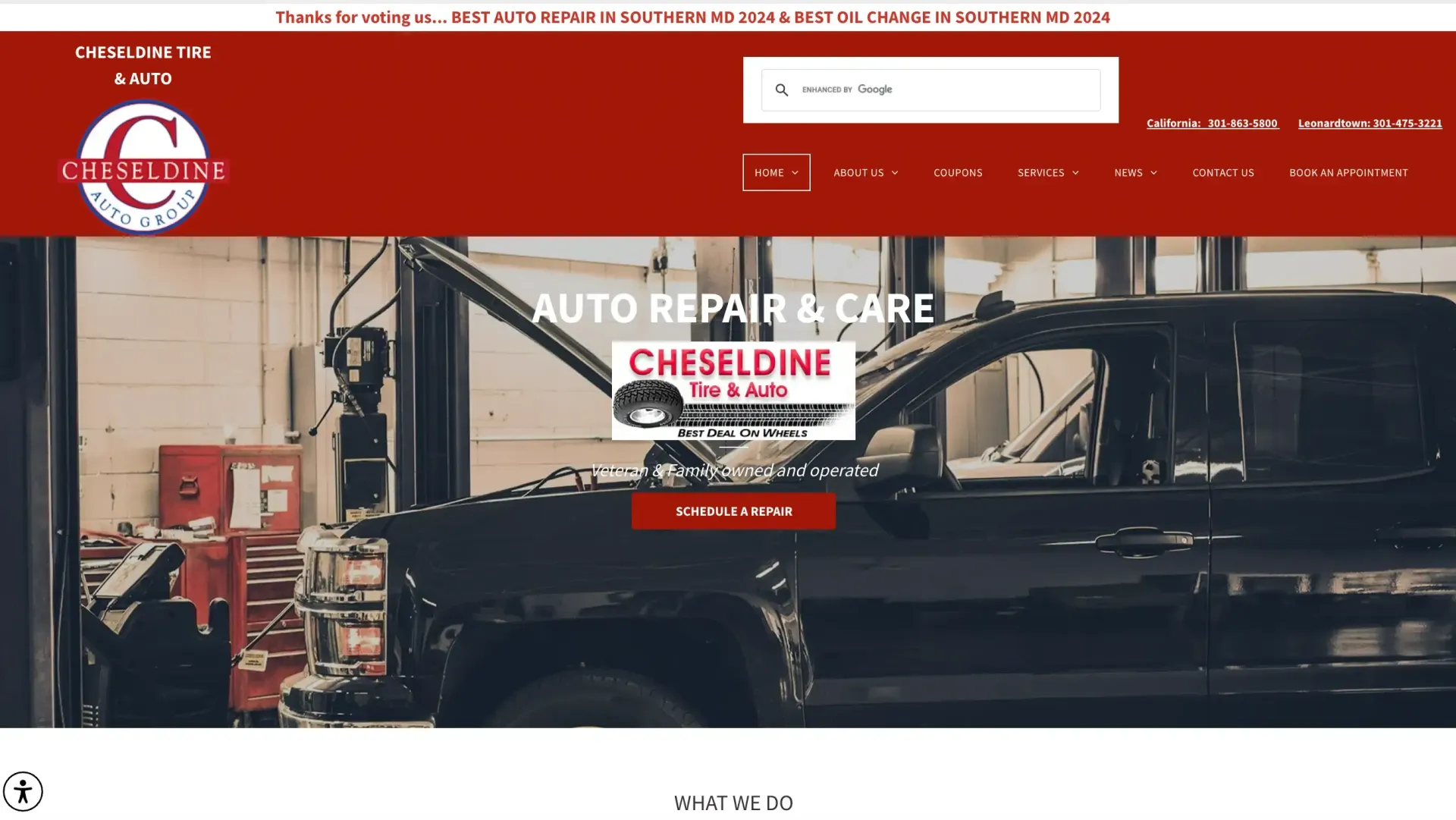 Auto repair shop website homepage with red header and a black pickup truck in a garage