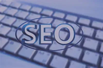 SEO text over a keyboard in blue tones