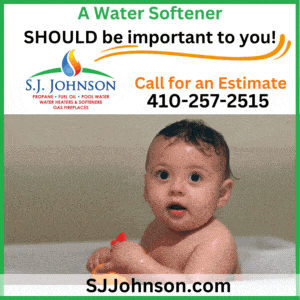 A water softener ad with a surprised baby in a bathtub and contact info for SJ Johnson
