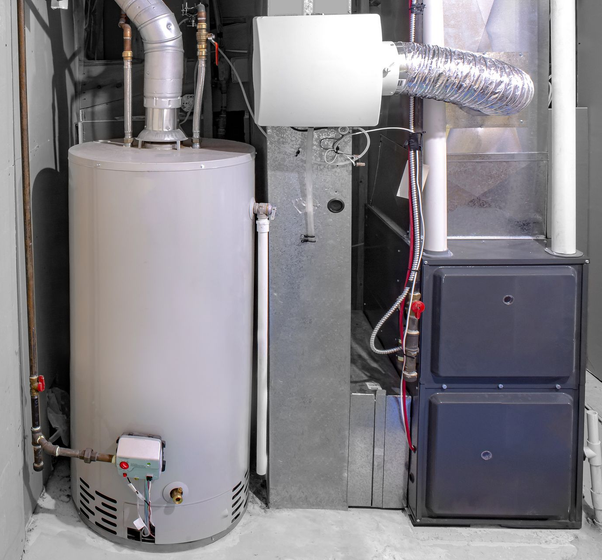 A light gray water heater stands next to a furnace unit with an attached white humidifier in a utility room.