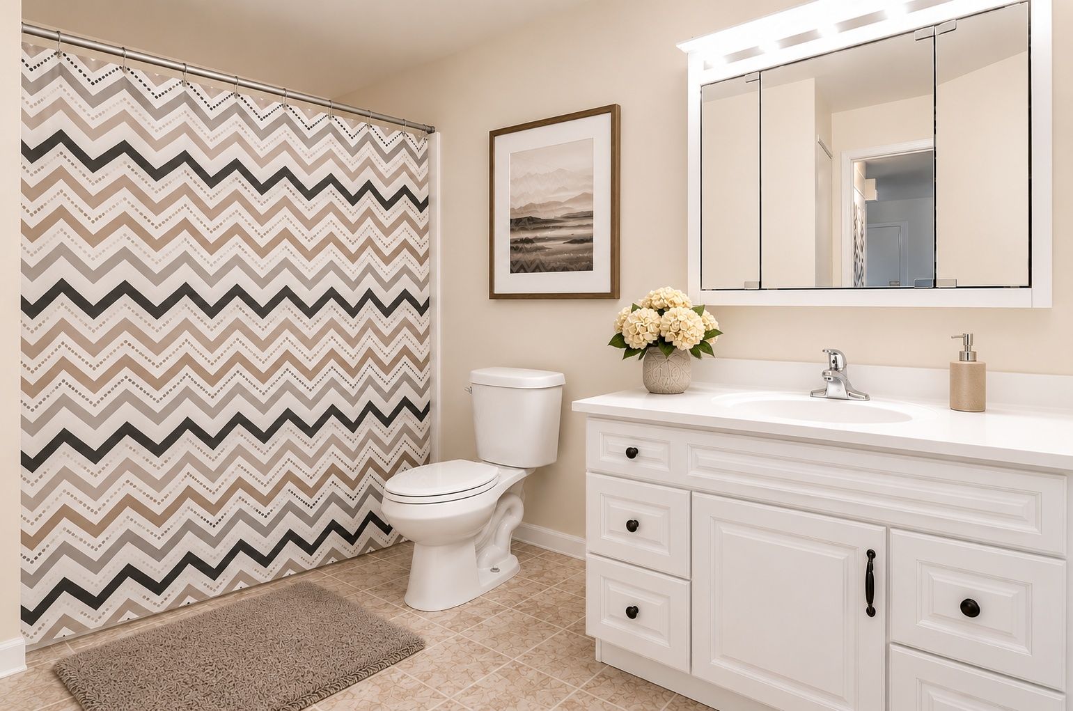 Bright bathroom with patterned shower curtain, toilet, and white vanity with mirror.