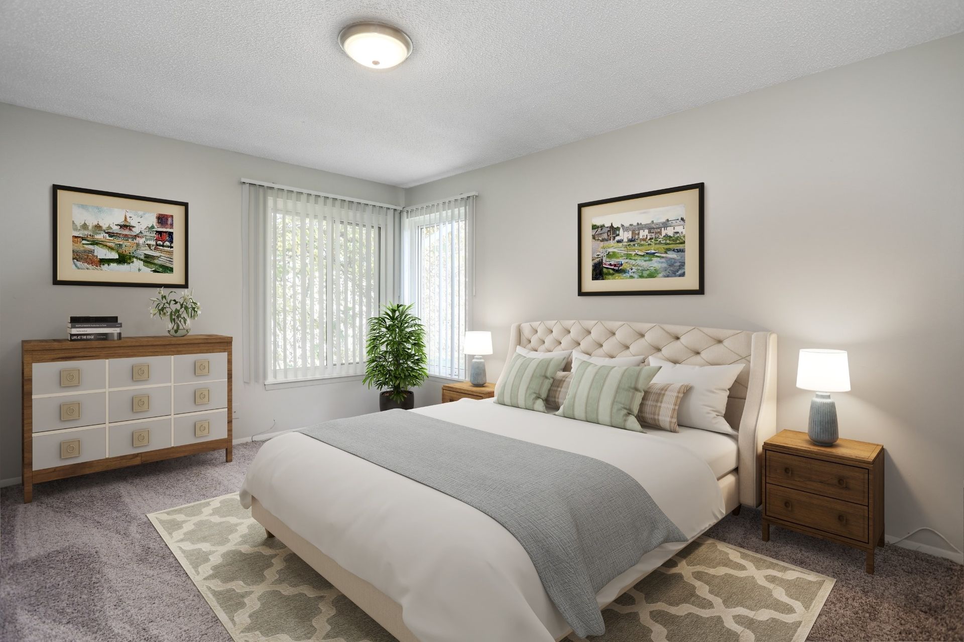 Bright bedroom with a bed, lamps, dresser, plants, and framed wall art