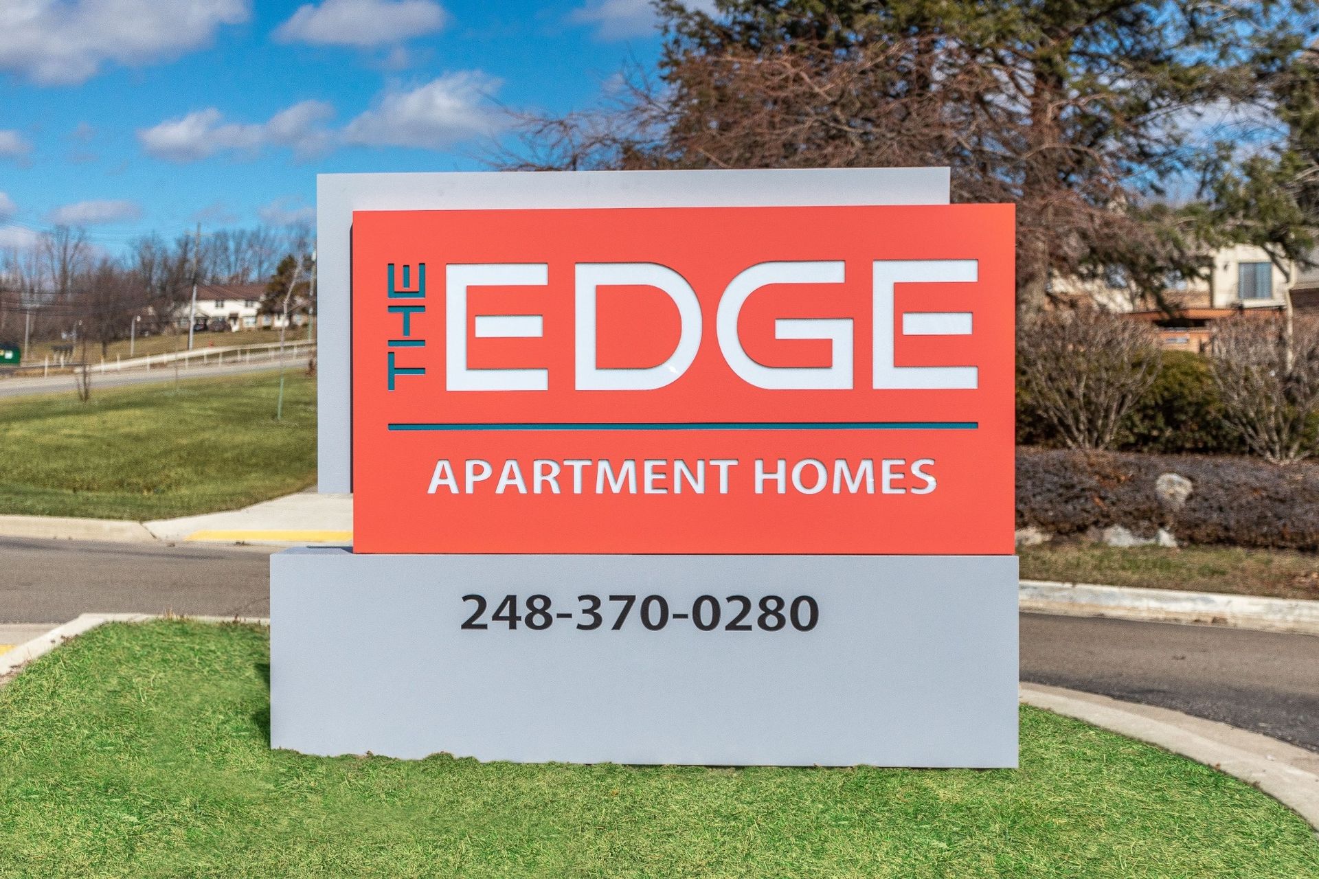 The Edge Apartment Homes roadside sign with phone number 248-370-0280