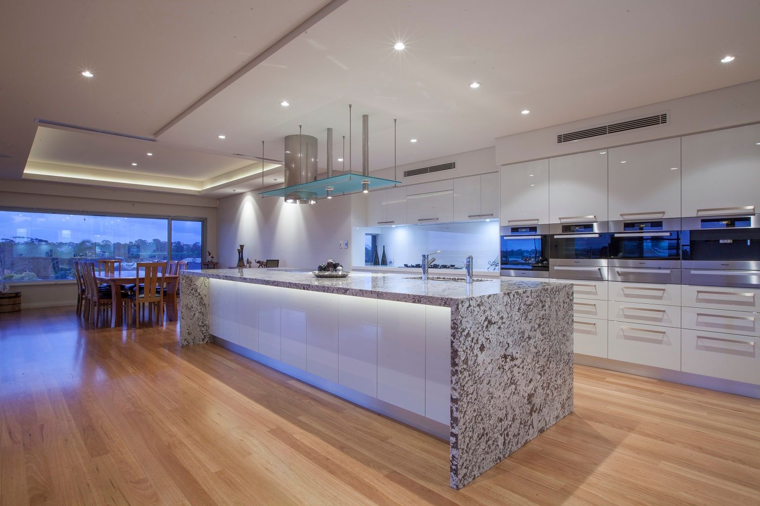 Chairs Arranged at Kitchen Island in Apartment | Glenorchy, TAS | McKay Timber