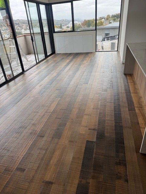 Elegant Tasmania oak flooring in open-plan living area with natural light and modern design