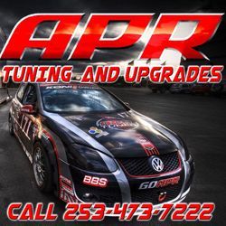 A Volkswagen race car on a track, featuring APR branding and the phone number 253-473-7222 in red text.