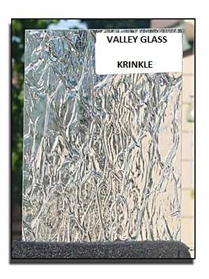 Crinkled clear glass panel labeled “VALLEY GLASS KRINKLE” in a framed display sample.