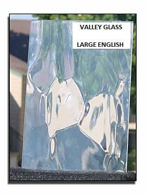 Clear wavy glass panel labeled “Valley Glass Large English” in a display frame