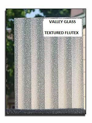 Sample of textured flute glass with vertical frosted stripes and label reading “VALLEY GLASS TEXTURED FLUTEX”