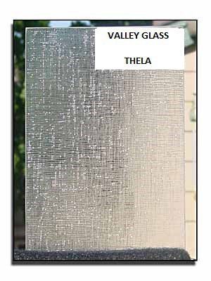Framed text panel titled “VALLEY GLASS” and “THELA” with a silver textured surface