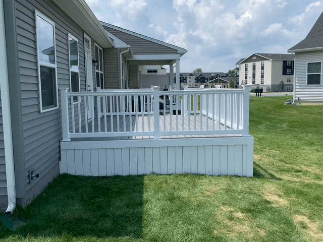 Remodeling Experts deck builder contractor custom deck along pool. Deck details... maintenance free composite decking with white vinyl railing 