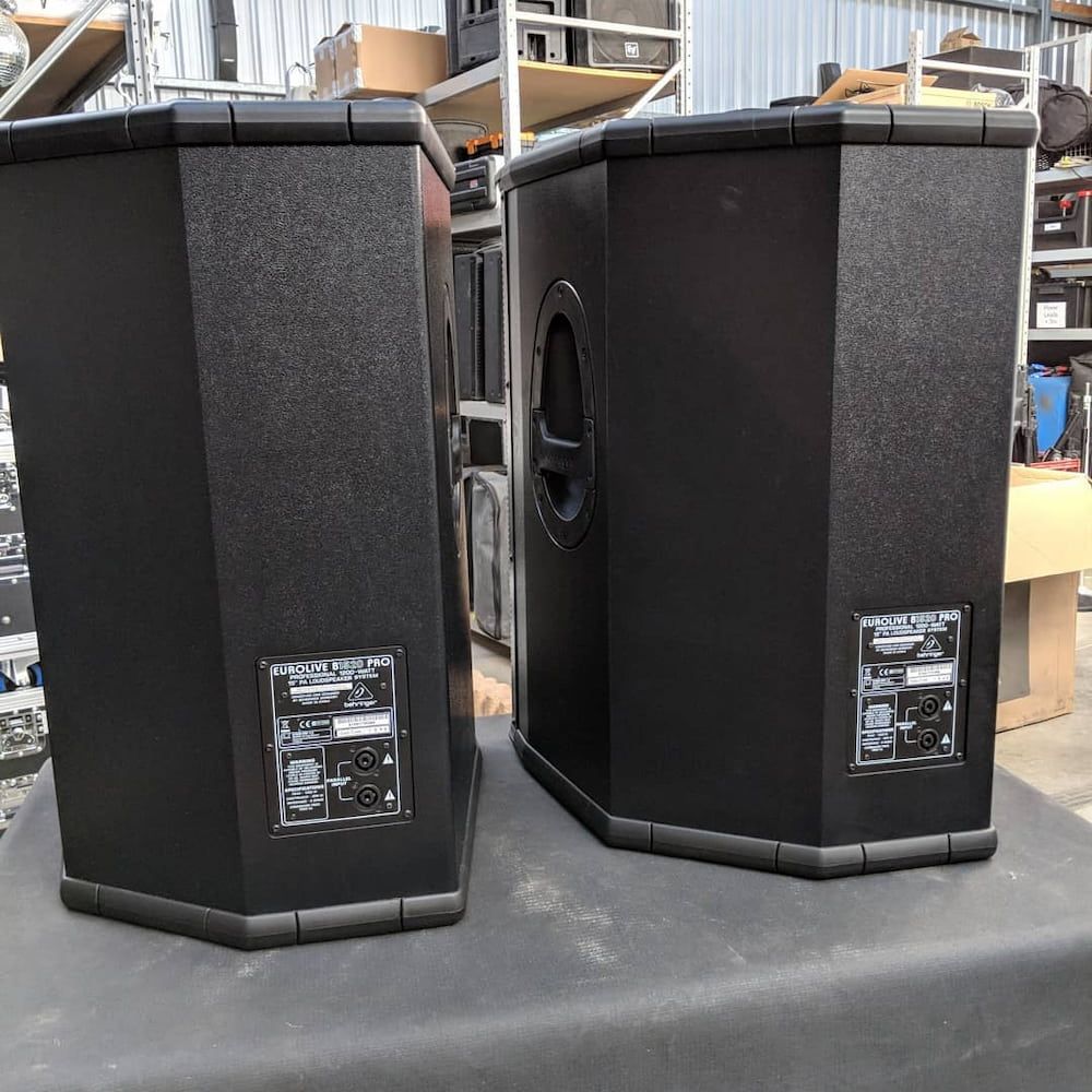 A Pair of Speakers Sitting on Top of a Table — Inspired Audio Visual in Coffs Harbour, NSW