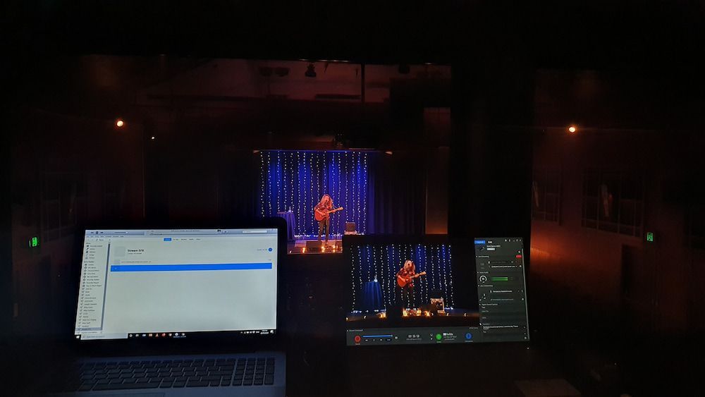 A Laptop is Sitting on a Desk in Front of Two Screens — Inspired Audio Visual in Grafton, NSW