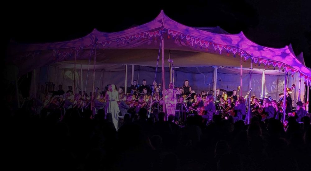 A Large Group of People Are Standing Under a Tent at a Concert — Inspired Audio Visual in Coffs Harbour, NSW