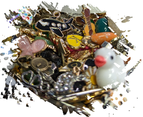 A purple bag filled with lots of different types of charms