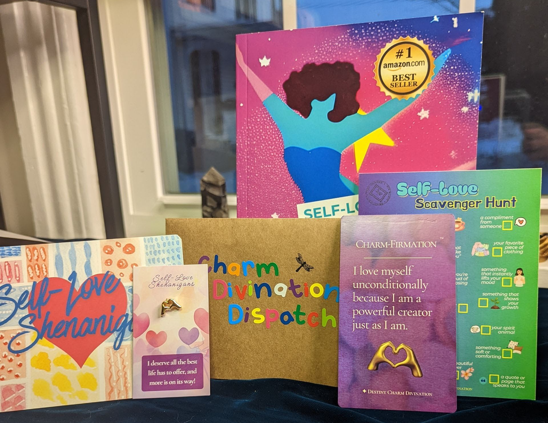 mail club items including postcard, stickers, activity, charm, affirmation card