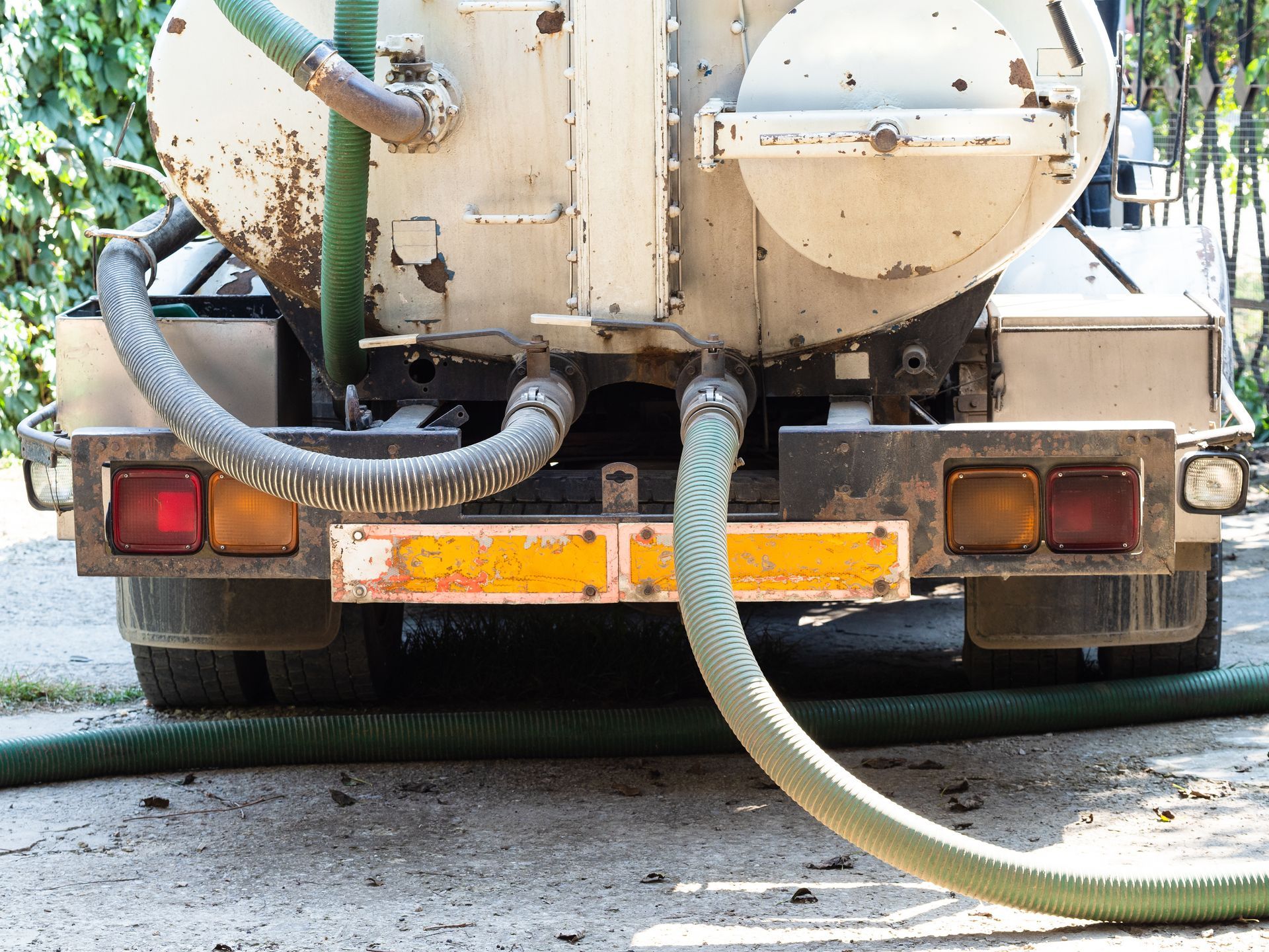 Professional septic pumping services using vacuum truck to clean and maintain septic systems
