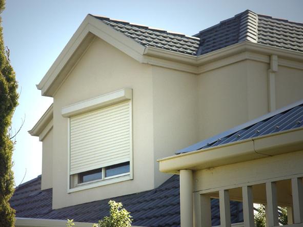 Rolling Shutters Brick House Windows Protection — Coordinations Blinds & Awnings in Falls Creek, NSW