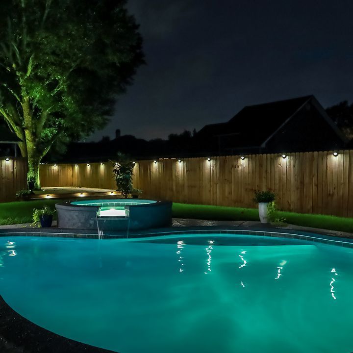 A Large Swimming Pool With Lights at Night - Madison, AL - Valley Pools
