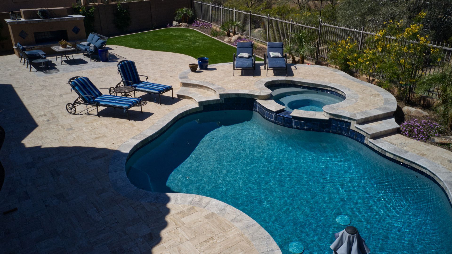 Pool renovations transforming a backyard with a custom swimming pool.